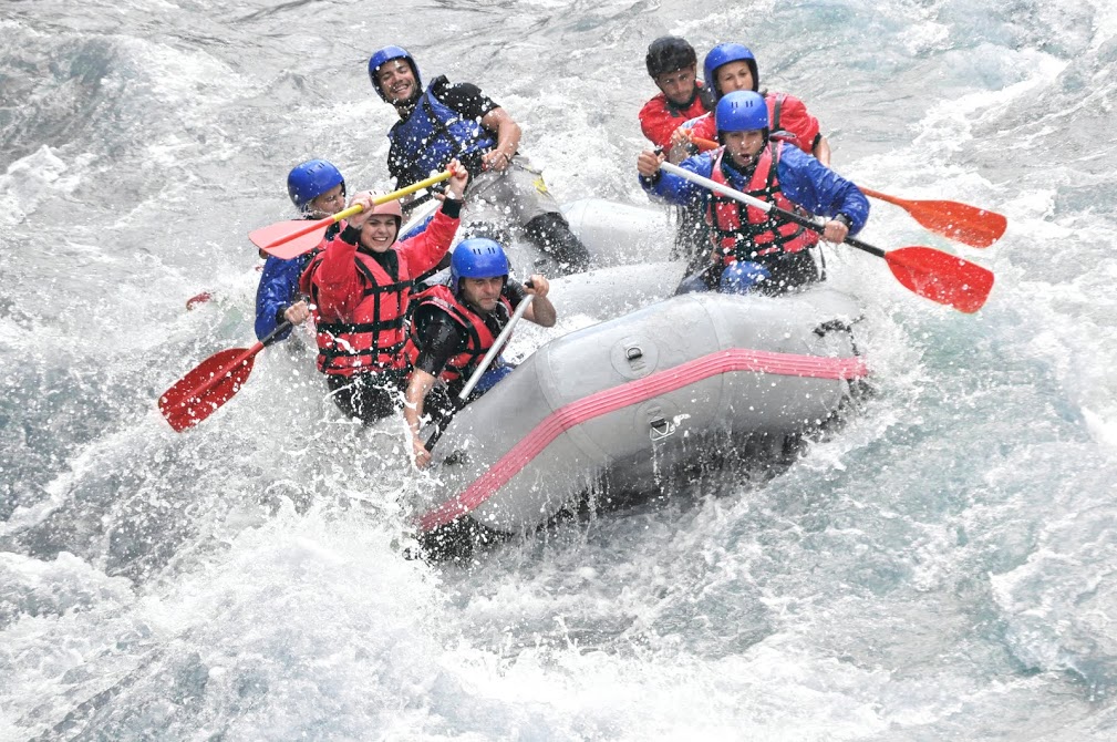 53ebb61f513016096e0bda9d_Rafting-splashing-the-white-w-50455433.jpg